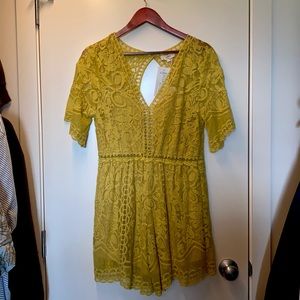 Yellow romper by “Entro”. Size large.